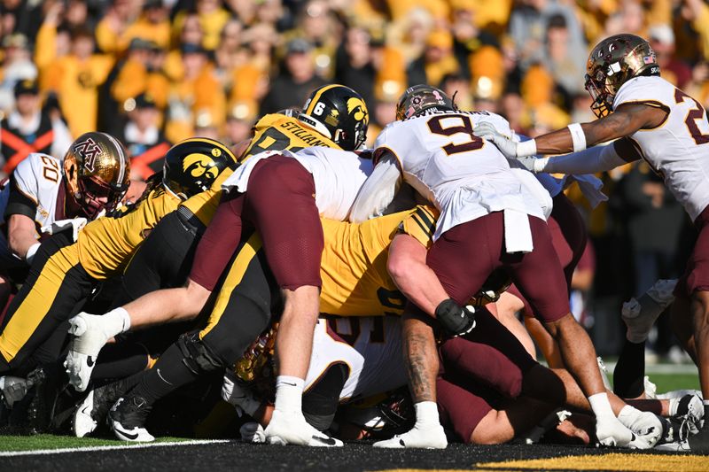 Oct 21, 2023; Iowa City, Iowa, USA; Iowa Hawkeyes quarterback Deacon Hill (not pictured) scores a touchdown on a sneak against the Minnesota Golden Gophers during the second quarter at Kinnick Stadium. Mandatory Credit: Jeffrey Becker-USA TODAY Sports