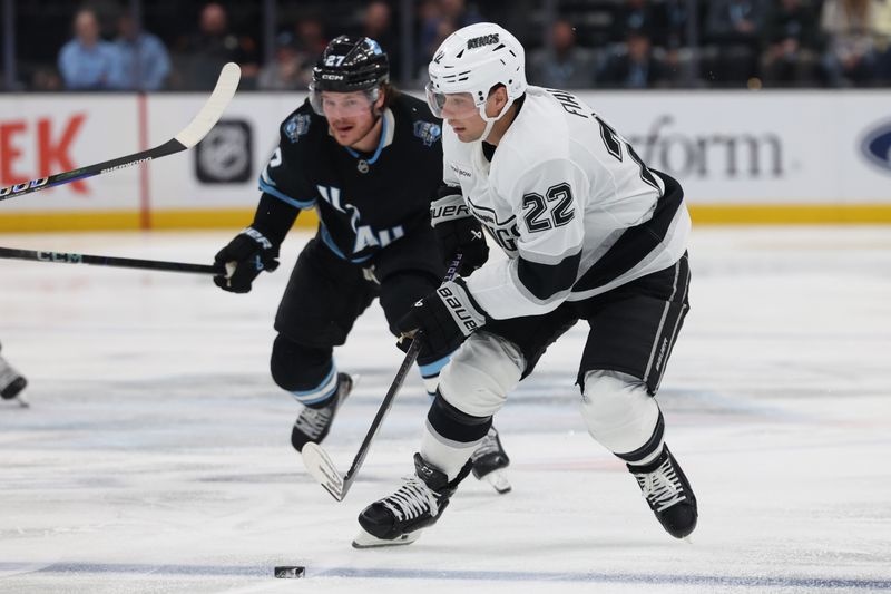 Apr 3, 2025; Salt Lake City, Utah, USA; Los Angeles Kings left wing Kevin Fiala (22) skates with the puck against the Utah Hockey Club during the third period at Delta Center. Mandatory Credit: Rob Gray-Imagn Images