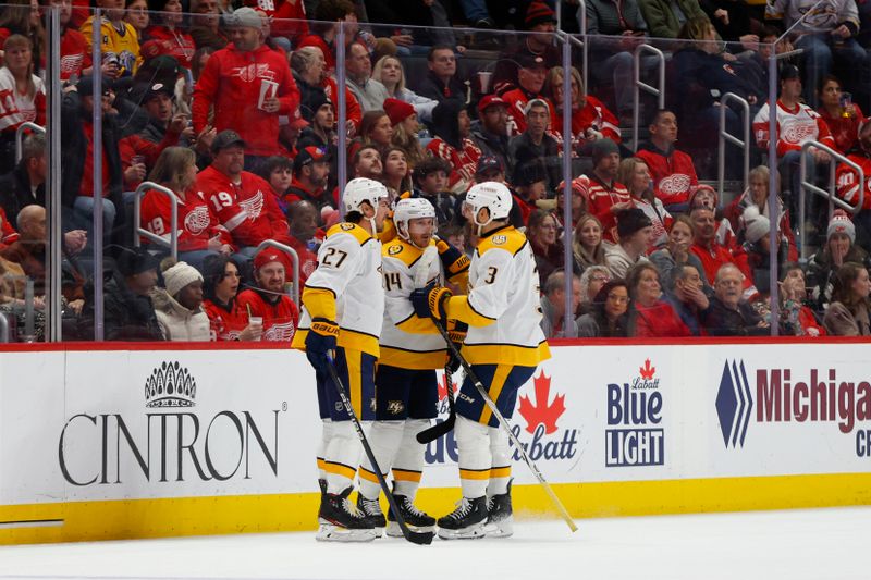 Dec 29, 2023; Detroit, Michigan, USA; Nashville Predators defensemen Ryan McDonagh (27) and Jeremy Lauzon (3) celebrate a goal by center Gustav Nyquist (14) during the second period of the game between the Nashville Predators and the Detroit Red Wings at Little Caesars Arena. Mandatory Credit: Brian Bradshaw Sevald-USA TODAY Sports