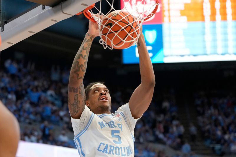 Jan 13, 2024; Chapel Hill, North Carolina, USA;  North Carolina Tar Heels forward Armando Bacot (5) scores in the second half at Dean E. Smith Center. Mandatory Credit: Bob Donnan-USA TODAY Sports