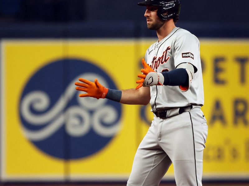 Apr 22, 2024; St. Petersburg, Florida, USA; Detroit Tigers outfielder Matt Vierling (8) doubles against the Tampa Bay Rays during the second inning at Tropicana Field. Mandatory Credit: Kim Klement Neitzel-USA TODAY Sports