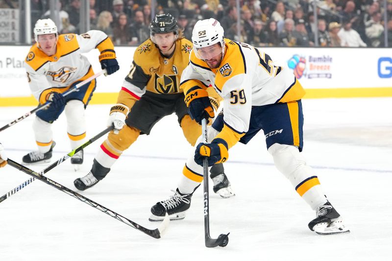 Feb 20, 2024; Las Vegas, Nevada, USA; Nashville Predators defenseman Roman Josi (59) controls the puck ahead of Vegas Golden Knights center William Karlsson (71) during the first period at T-Mobile Arena. Mandatory Credit: Stephen R. Sylvanie-USA TODAY Sports