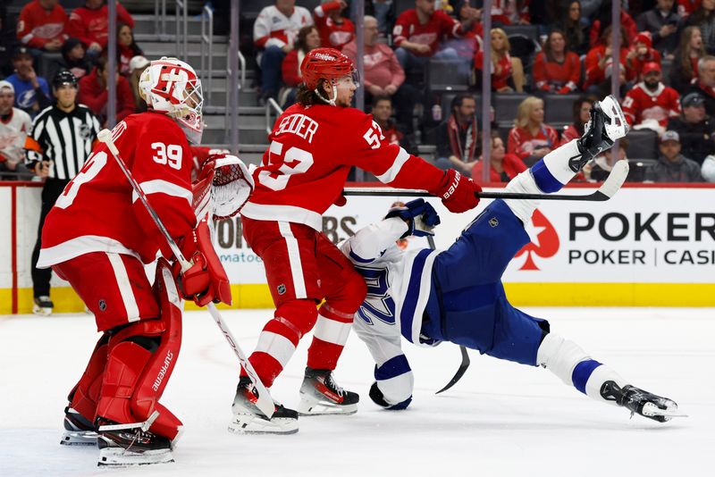 Jan 25, 2025; Detroit, Michigan, USA;  Detroit Red Wings defenseman Moritz Seider (53) and Tampa Bay Lightning left wing Nick Paul (20) fight for position in front of goaltender Cam Talbot (39) in the third period at Little Caesars Arena. Mandatory Credit: Rick Osentoski-Imagn Images