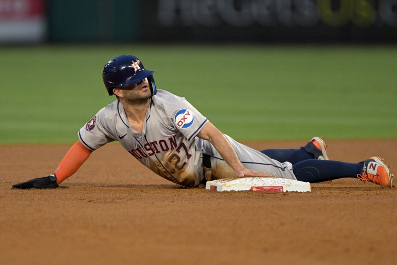 Jun 8, 2024; Anaheim, California, USA;  Houston Astros second baseman Jose Altuve (27) is safe at second with a stolen base in the third inning against the Los Angeles Angels at Angel Stadium. Mandatory Credit: Jayne Kamin-Oncea-USA TODAY Sports