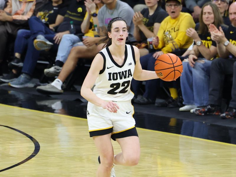 Mar 3, 2024; Iowa City, Iowa, USA;  Iowa Hawkeyes guard Caitlin Clark (22) sets the offense against the Ohio State Buckeyes during the first half at Carver-Hawkeye Arena. Mandatory Credit: Reese Strickland-USA TODAY Sports