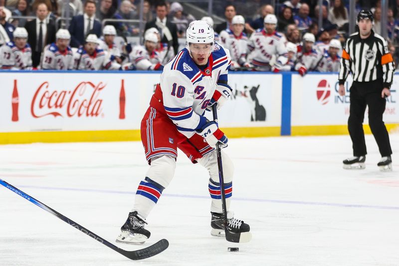 Dec 27, 2025; Elmont, New York, USA;  New York Rangers left wing Artemi Panarin (10) controls the puck in the first period against the New York Islanders at UBS Arena. Mandatory Credit: Wendell Cruz-Imagn Images