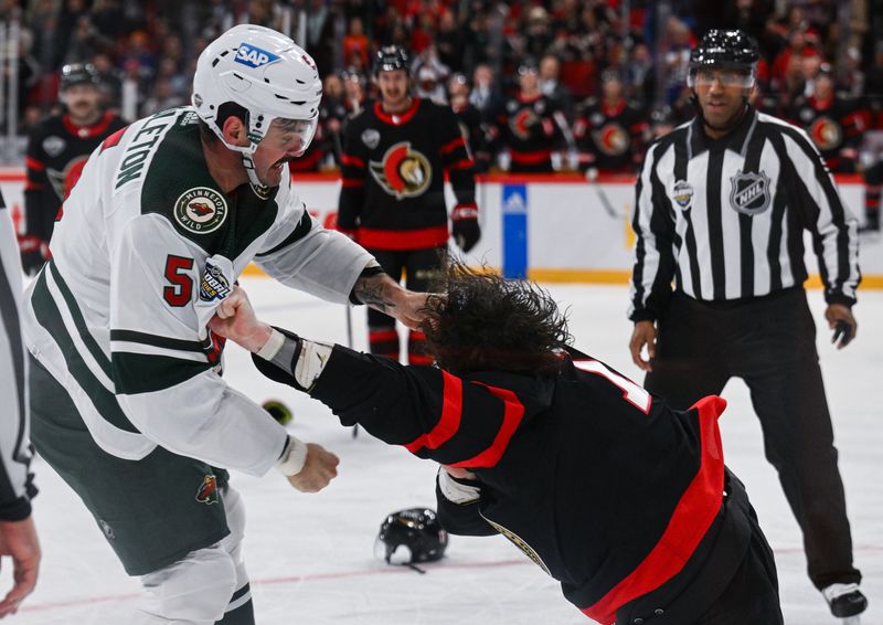 Nov 18, 2023; Stockholm, SWE; Minnesota Wild defenseman Jake Middleton (5) fights with Ottawa Senators center Zack MacEwen (17) during a Global Series NHL hockey game at Avicii Arena. Mandatory Credit: Per Haljestam-USA TODAY Sports