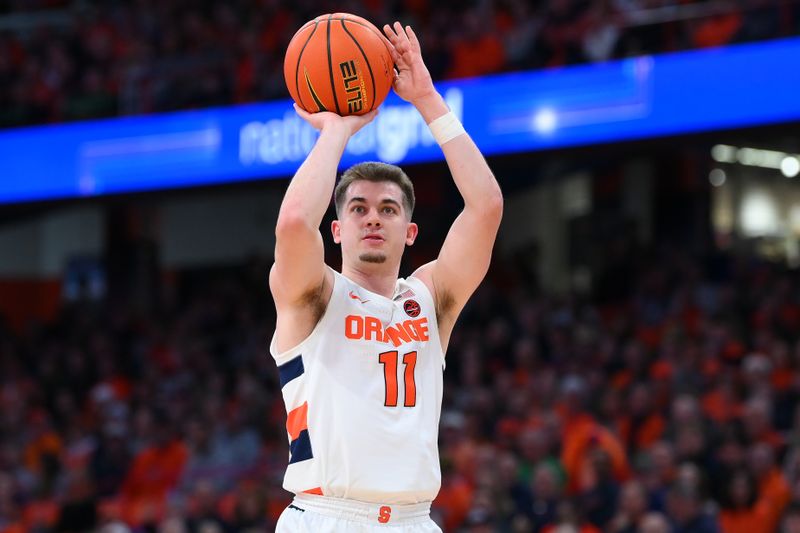 Jan 14, 2023; Syracuse, New York, USA; Syracuse Orange guard Joseph Girard III (11) shoots the ball against the Notre Dame Fighting Irish during the first half at the JMA Wireless Dome. Mandatory Credit: Rich Barnes-USA TODAY Sports