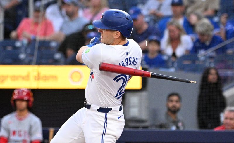 Aug 22, 2024; Toronto, Ontario, CAN;  Toronto Blue Jays center fielder Daulton Varsho (25) breaks his bat as he grounds out against the Los Angeles Angels in the first inning at Rogers Centre. Mandatory Credit: Dan Hamilton-USA TODAY Sports