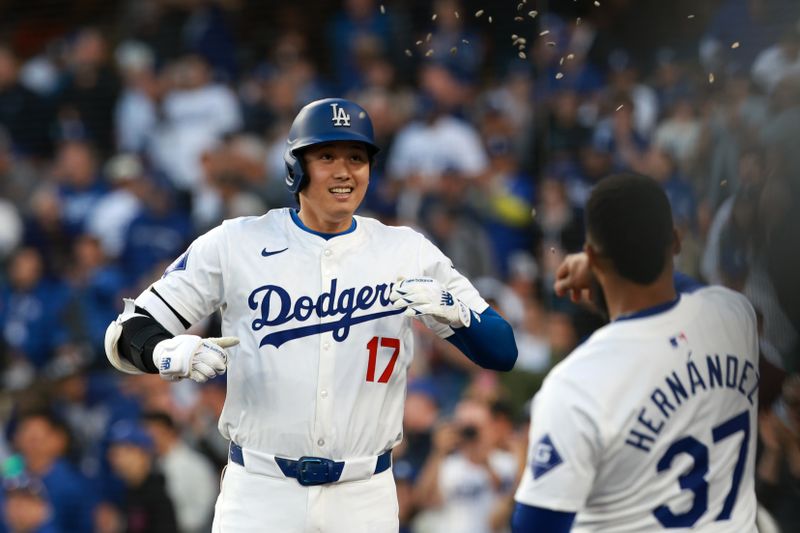 May 6, 2024; Los Angeles, California, USA;  Los Angeles Dodgers designated hitter Shohei Ohtani (17) celebrates with outfielder Teoscar Hernandez (37) after hitting a home run during the first inning against the Miami Marlins at Dodger Stadium. Mandatory Credit: Kiyoshi Mio-USA TODAY Sports