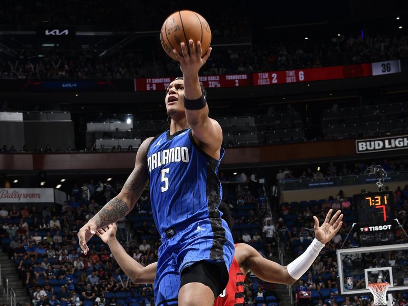 ORLANDO, FL - APRIL 1: Paolo Banchero #5 of the Orlando Magic drives to the basket during the game against the Portland Trail Blazers on April 1, 2024 at Kia Center in Orlando, Florida. NOTE TO USER: User expressly acknowledges and agrees that, by downloading and or using this photograph, User is consenting to the terms and conditions of the Getty Images License Agreement. Mandatory Copyright Notice: Copyright 2024 NBAE (Photo by Fernando Medina/NBAE via Getty Images)