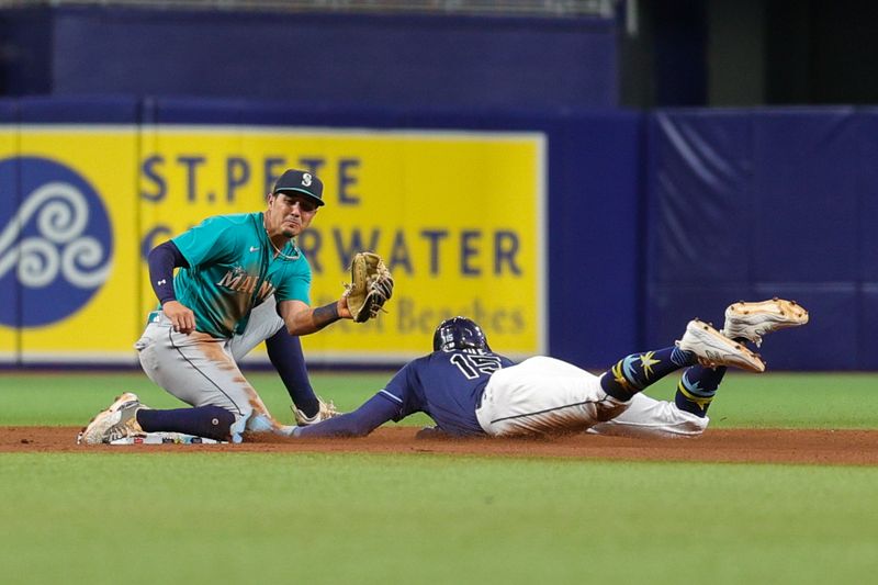 Sep 7, 2023; St. Petersburg, Florida, USA;  Tampa Bay Rays right fielder Josh Lowe (15) is caught stealing by Seattle Mariners second baseman Josh Rojas (4) in the fifth inning at Tropicana Field. Mandatory Credit: Nathan Ray Seebeck-USA TODAY Sports