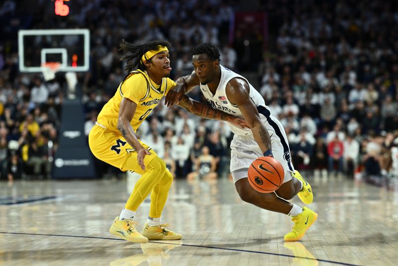 Jan 7, 2024; Philadelphia, Pennsylvania, USA; Penn State Nittany Lions guard Kanye Clary (0) drives against Michigan Wolverines guard Dug McDaniel (0) in the first half at The Palestra. Mandatory Credit: Kyle Ross-USA TODAY Sports