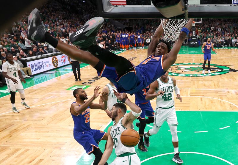BOSTON, MASSACHUSETTS - MAY 05: OG Anunoby #8 of the New York Knicks dunks the ball against Jayson Tatum #0 of the Boston Celtics in Game One of the Eastern Conference Second Round NBA Playoffs at TD Garden on May 05, 2025 in Boston, Massachusetts. NOTE TO USER: User expressly acknowledges and agrees that, by downloading and or using this photograph, User is consenting to the terms and conditions of the Getty Images License Agreement. (Photo by Maddie Meyer/Getty Images)