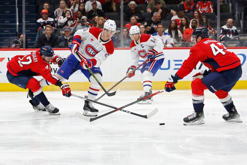 Oct 31, 2024; Washington, District of Columbia, USA; /w20/ passes the puck as Washington Capitals defenseman Martin Fehervary (42) defends in the second period at Capital One Arena. Mandatory Credit: Geoff Burke-Imagn Images