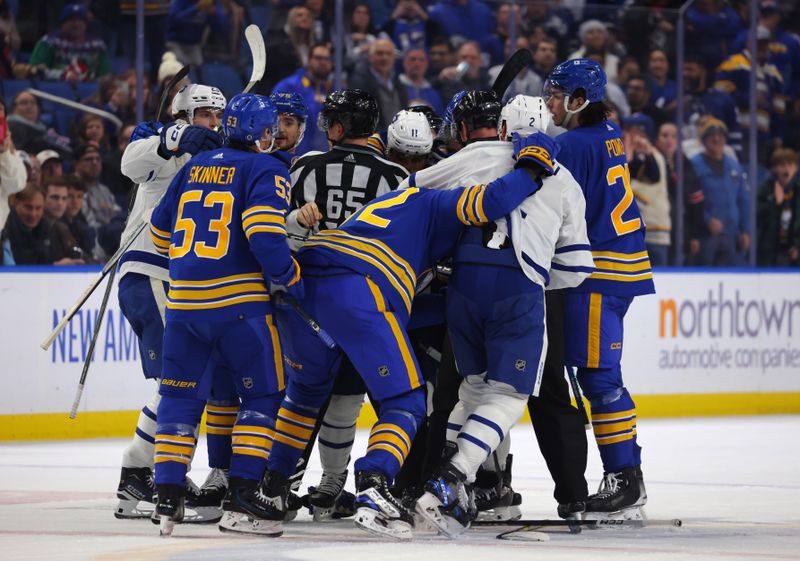 Dec 21, 2023; Buffalo, New York, USA;  Toronto Maple Leafs and Buffalo Sabres players in a scrum after a whistle during the third period at KeyBank Center. Mandatory Credit: Timothy T. Ludwig-USA TODAY Sports