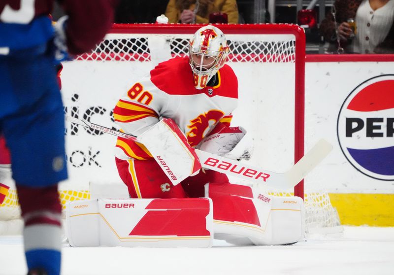 Dec 11, 2023; Denver, Colorado, USA; Calgary Flames goaltender Dan Vladar (80) makes a save in the first period against the Colorado Avalanche at Ball Arena. Mandatory Credit: Ron Chenoy-USA TODAY Sports