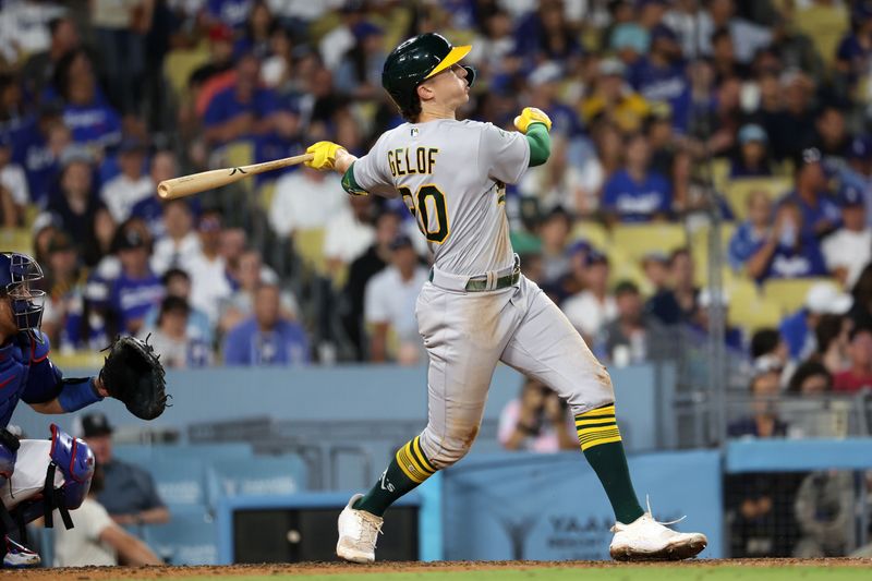 Aug 3, 2023; Los Angeles, California, USA;  Oakland Athletics second baseman Zack Gelof (20) hits a home run during the sixth inning against the Los Angeles Dodgers at Dodger Stadium. Mandatory Credit: Kiyoshi Mio-USA TODAY Sports