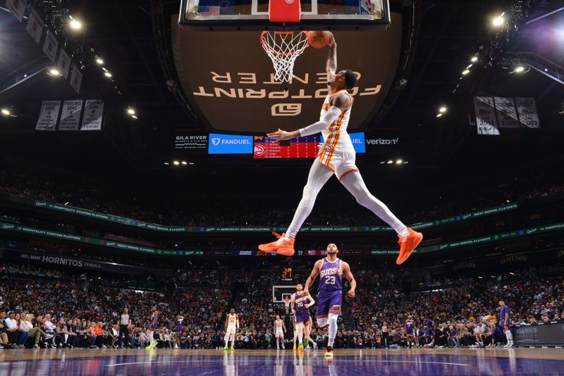 PHOENIX, AZ - MARCH 21:  Dejounte Murray #5 of the Atlanta Hawks slam dunk during the game  on March 21, 2024 at Footprint Center in Phoenix, Arizona. NOTE TO USER: User expressly acknowledges and agrees that, by downloading and or using this photograph, user is consenting to the terms and conditions of the Getty Images License Agreement. Mandatory Copyright Notice: Copyright 2024 NBAE (Photo by Barry Gossage/NBAE via Getty Images)