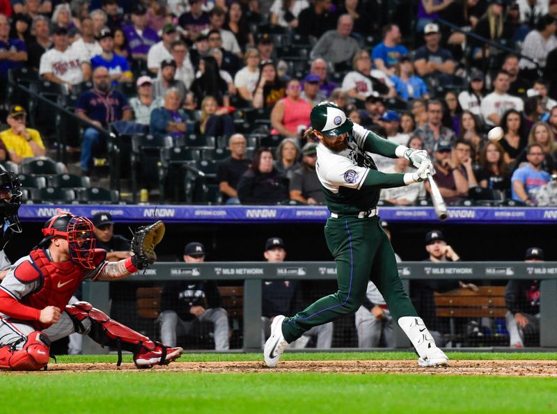 Sep 30, 2023; Denver, Colorado, USA;  Colorado Rockies second baseman Brendan Rodgers (7) hits a double in the sixth inning against the Minnesota Twins at Coors Field. Mandatory Credit: John Leyba-USA TODAY Sports