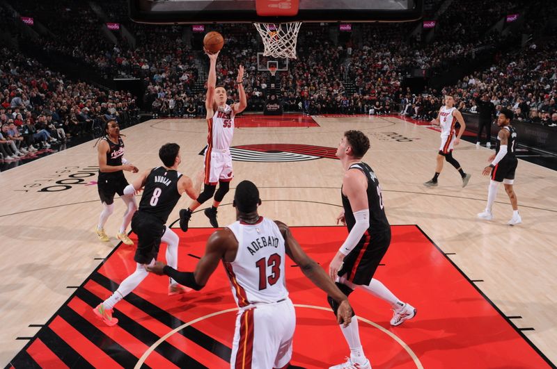 PORTLAND, OR - JANUARY 11: Duncan Robinson #55 of the Miami Heat shoots the ball during the gameagainst the Portland Trail Blazers  on January 11, 2025 at the Moda Center Arena in Portland, Oregon. NOTE TO USER: User expressly acknowledges and agrees that, by downloading and or using this photograph, user is consenting to the terms and conditions of the Getty Images License Agreement. Mandatory Copyright Notice: Copyright 2025 NBAE (Photo by Cameron Browne/NBAE via Getty Images)