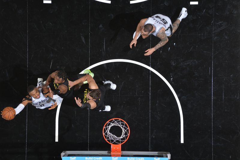 SAN ANTONIO, TX - OCTOBER 12: Keldon Johnson #0 of the San Antonio Spurs shoots the ball during the game against the Utah Jazz during a NBA preseason game on October 12, 2024 at the Frost Bank Center in San Antonio, Texas. NOTE TO USER: User expressly acknowledges and agrees that, by downloading and or using this photograph, user is consenting to the terms and conditions of the Getty Images License Agreement. Mandatory Copyright Notice: Copyright 2024 NBAE (Photos by Michael Gonzales/NBAE via Getty Images)