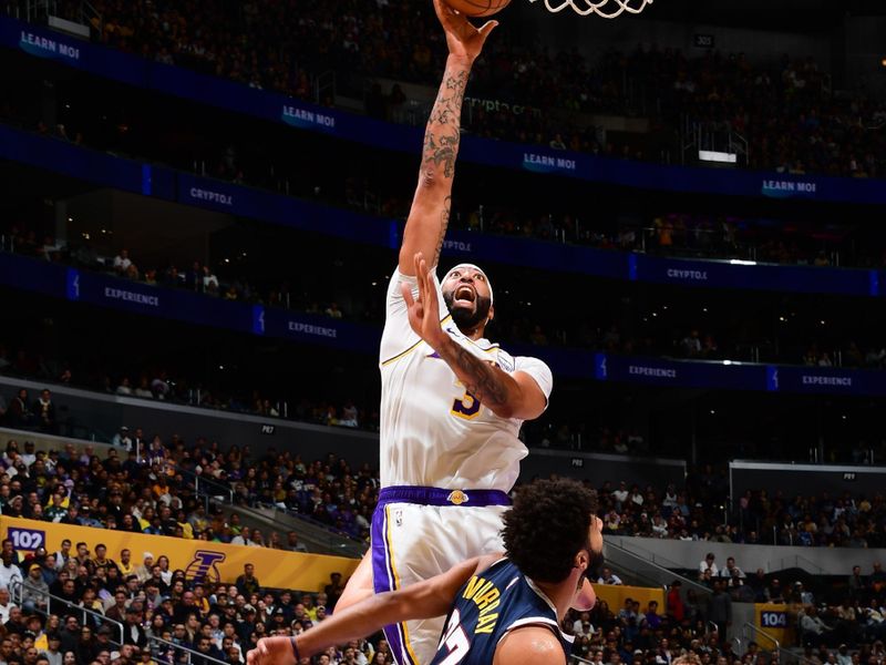 LOS ANGELES, CA - NOVEMBER 23: Anthony Davis #3 of the Los Angeles Lakers drives to the basket during the game against the Denver Nuggets on November 23, 2024 at Crypto.Com Arena in Los Angeles, California. NOTE TO USER: User expressly acknowledges and agrees that, by downloading and/or using this Photograph, user is consenting to the terms and conditions of the Getty Images License Agreement. Mandatory Copyright Notice: Copyright 2024 NBAE (Photo by Adam Pantozzi/NBAE via Getty Images)