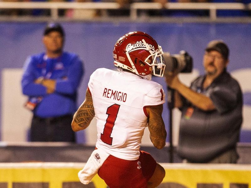 Oct 8, 2022; Boise, Idaho, USA; Fresno State Bulldogs wide receiver Nikko Remigio (1) scores a touchdown during first half action versus the Boise State Broncos at Albertsons Stadium. Mandatory Credit: Brian Losness-USA TODAY Sports