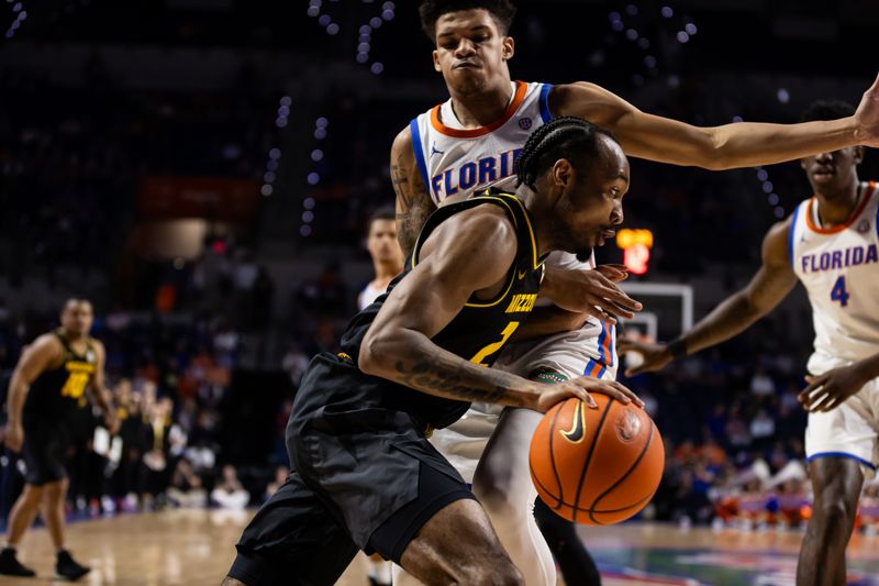 Feb 28, 2024; Gainesville, Florida, USA; Missouri Tigers guard Tamar Bates (2) drives to the basket against Florida Gators guard Will Richard (5) during the first half at Exactech Arena at the Stephen C. O'Connell Center. Mandatory Credit: Matt Pendleton-USA TODAY Sports