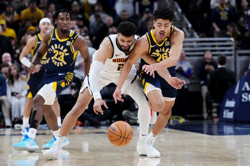 INDIANAPOLIS, INDIANA - JANUARY 23: Jamal Murray #27 of the Denver Nuggets and Ben Sheppard #26 of the Indiana Pacers dive for a loose ball in the fourth quarter at Gainbridge Fieldhouse on January 23, 2024 in Indianapolis, Indiana. NOTE TO USER: User expressly acknowledges and agrees that, by downloading and or using this photograph, User is consenting to the terms and conditions of the Getty Images License Agreement. (Photo by Dylan Buell/Getty Images)