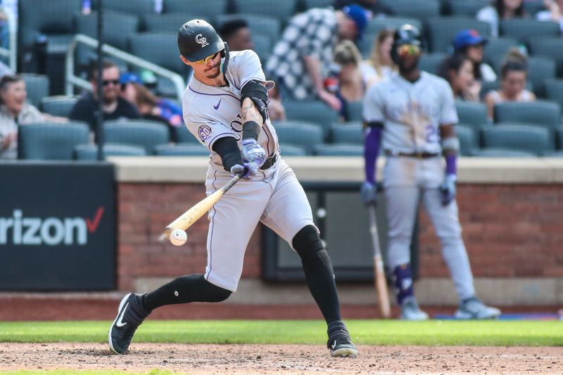 May 7, 2023; New York City, New York, USA;  Colorado Rockies center fielder Brenton Doyle (9) hits an RBI fielder   s choice in the ninth inning against the New York Mets at Citi Field. Mandatory Credit: Wendell Cruz-USA TODAY Sports