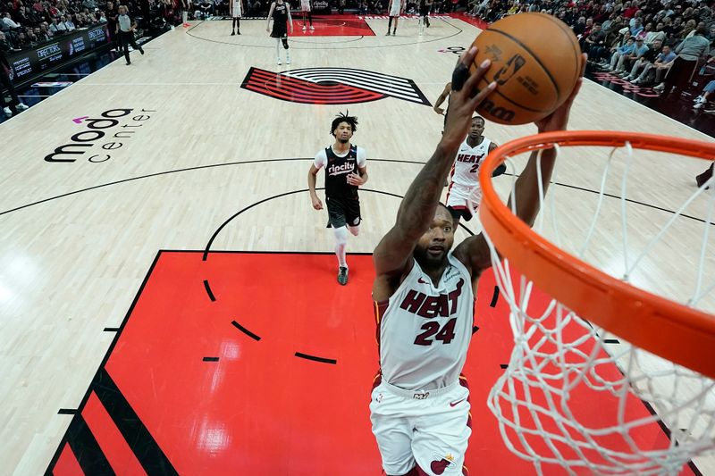 PORTLAND, OREGON - JANUARY 11: Haywood Highsmith #24 of the Miami Heat dunks the ball during the second half against the Portland Trail Blazers at Moda Center on January 11, 2025 in Portland, Oregon. NOTE TO USER: User expressly acknowledges and agrees that, by downloading and or using this photograph, User is consenting to the terms and conditions of the Getty Images License Agreement. (Photo by Soobum Im/Getty Images)