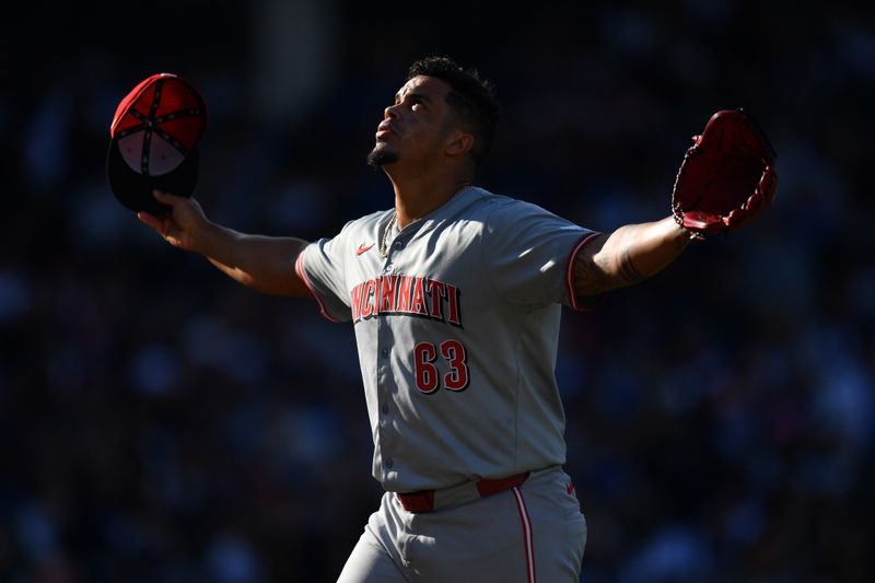 Sep 29, 2024; Chicago, Illinois, USA; Cincinnati Reds relief pitcher Fernando Cruz (63) reacts after being taken out of the game during the sixth inning against the Chicago Cubs at Wrigley Field. Mandatory Credit: Patrick Gorski-Imagn Images