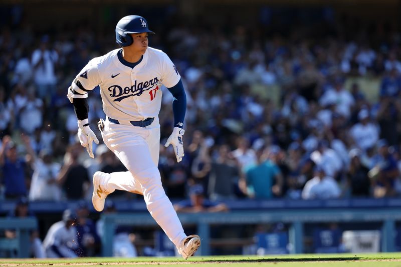 Sep 22, 2024; Los Angeles, California, USA;  Los Angeles Dodgers designated hitter Shohei Ohtani (17) hits a single during the seventh inning against the Colorado Rockies at Dodger Stadium. Mandatory Credit: Kiyoshi Mio-Imagn Images