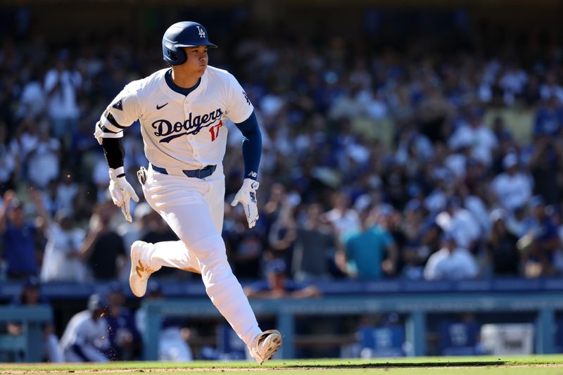 Sep 22, 2024; Los Angeles, California, USA;  Los Angeles Dodgers designated hitter Shohei Ohtani (17) hits a single during the seventh inning against the Colorado Rockies at Dodger Stadium. Mandatory Credit: Kiyoshi Mio-Imagn Images