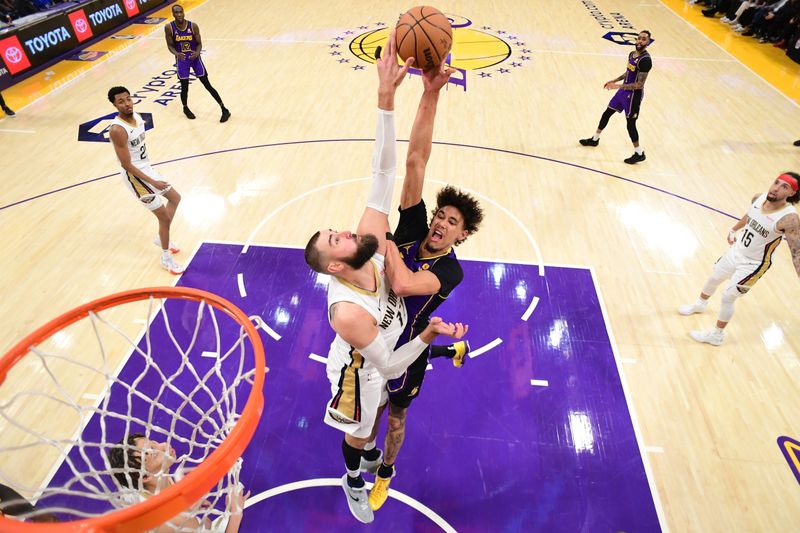 LOS ANGELES, CA - FEBRUARY 9:  Jonas Valanciunas #17 of the New Orleans Pelicans blocks the shot of Jaxson Hayes #11 of the Los Angeles Lakers on February 9, 2024 at Crypto.Com Arena in Los Angeles, California. NOTE TO USER: User expressly acknowledges and agrees that, by downloading and/or using this Photograph, user is consenting to the terms and conditions of the Getty Images License Agreement. Mandatory Copyright Notice: Copyright 2024 NBAE (Photo by Adam Pantozzi/NBAE via Getty Images)