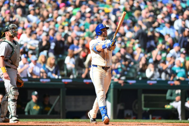 Sep 29, 2024; Seattle, Washington, USA; Seattle Mariners catcher Cal Raleigh (29) hits a 2-run home run against the Oakland Athletics during the fifth inning at T-Mobile Park. Mandatory Credit: Steven Bisig-Imagn Images