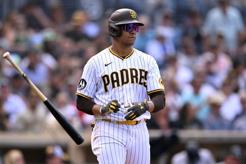 Sep 20, 2023; San Diego, California, USA; San Diego Padres left fielder Juan Soto (22) tosses his bat after a walk against the Colorado Rockies during the seventh inning at Petco Park. Mandatory Credit: Orlando Ramirez-USA TODAY Sports