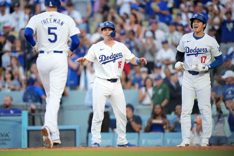 Jul 3, 2024; Los Angeles, California, USA; Los Angeles Dodgers first baseman Freddie Freeman (5) celebrates with catcher Will Smith (16) and designated hitter Shohei Ohtani (17) after hitting a three-run home run in the first inning against the Arizona Diamondbacks at Dodger Stadium. Mandatory Credit: Kirby Lee-USA TODAY Sports