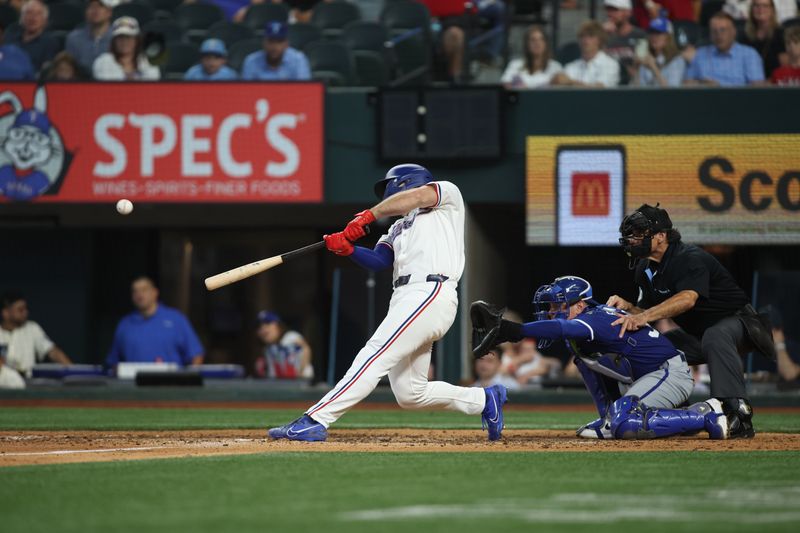 Jun 22, 2024; Arlington, Texas, USA; Texas Rangers left fielder Wyatt Langford (36) hits a grand slam home run in the eighth inning against the Kansas City Royals at Globe Life Field. Mandatory Credit: Tim Heitman-USA TODAY Sports