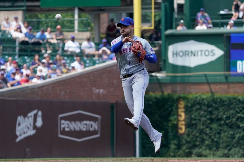 Jun 21, 2024; Chicago, Illinois, USA; New York Mets second base Jose Iglesias (11) makes a play against the Chicago Cubs during the first inning at Wrigley Field. Mandatory Credit: David Banks-USA TODAY Sports