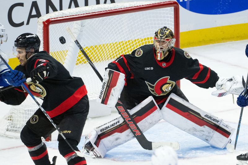 Jan 13, 2026; Ottawa, Ontario, CAN; Ottawa Senators goalie Leevi Merilainen (1) follows the puck after making a save in the third period against the Vancouver Canucks at the Canadian Tire Centre. Mandatory Credit: Marc DesRosiers-IMAGN Images