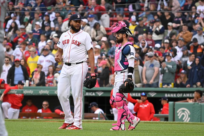 May 12, 2024; Boston, Massachusetts, USA;  Boston Red Sox catcher Connor Wong (12) and  pitcher Kenley Jansen (74) wait for a replay review during the ninth inning against the Washington Nationals at Fenway Park. Mandatory Credit: Eric Canha-USA TODAY Sports