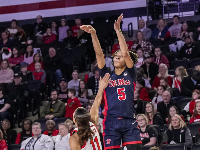 Jan 21, 2024; Athens, Georgia, USA; Ole Miss Rebels forward Snudda Collins (5) shoots over Georgia Bulldogs guard Asia Avinger (11) during the second half at Stegeman Coliseum. Mandatory Credit: Dale Zanine-USA TODAY Sports