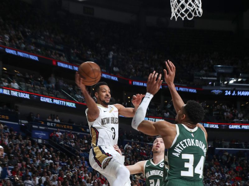 NEW ORLEANS, LA - MARCH 28: CJ McCollum #3 of the New Orleans Pelicans passes the ball during the game on March 28, 2024 at the Smoothie King Center in New Orleans, Louisiana. NOTE TO USER: User expressly acknowledges and agrees that, by downloading and or using this Photograph, user is consenting to the terms and conditions of the Getty Images License Agreement. Mandatory Copyright Notice: Copyright 2024 NBAE (Photo by Layne Murdoch Jr./NBAE via Getty Images)