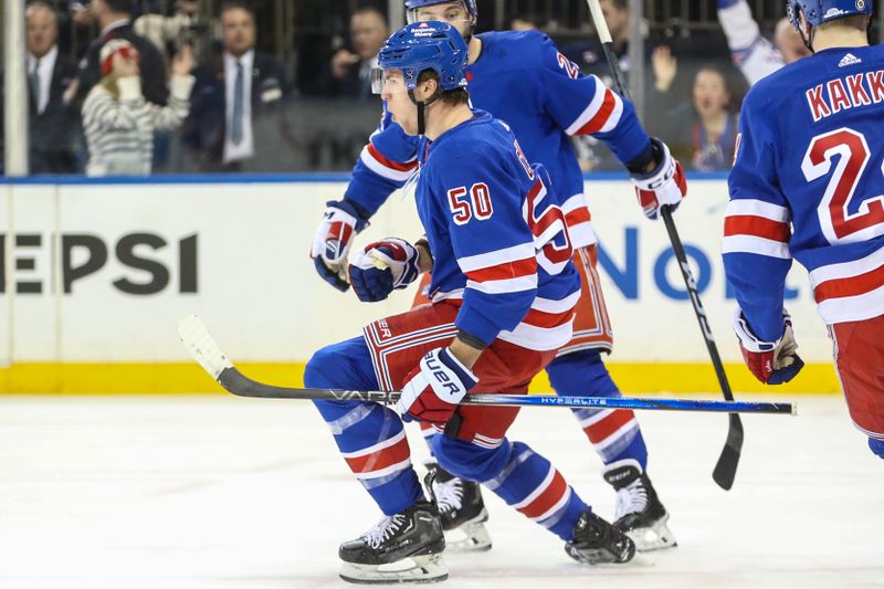 Feb 15, 2024; New York, New York, USA; New York Rangers left wing Will Cuylle (50) celebrates after scoring a goal in the second period against the Montreal Canadiens at Madison Square Garden. Mandatory Credit: Wendell Cruz-USA TODAY Sports