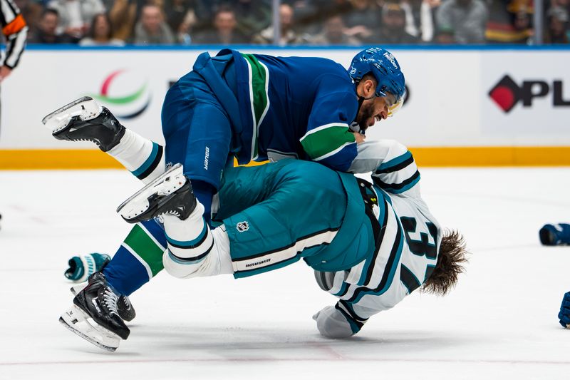 Jan 27, 2026; Vancouver, British Columbia, CAN; Vancouver Canucks forward Evander Kane (91) fights with San Jose Sharks defenseman Timothy Liljegren (37) in the second period at Rogers Arena. Mandatory Credit: Bob Frid-Imagn Images