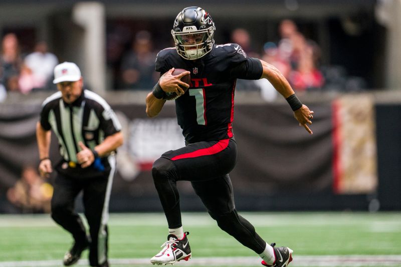 Atlanta Falcons quarterback Marcus Mariota (1) runs the ball during the first half of an NFL football game against the Los Angeles Chargers, Sunday, Nov. 6, 2022, in Atlanta. The Los Angeles Chargers won 20-17. (AP Photo/Danny Karnik)