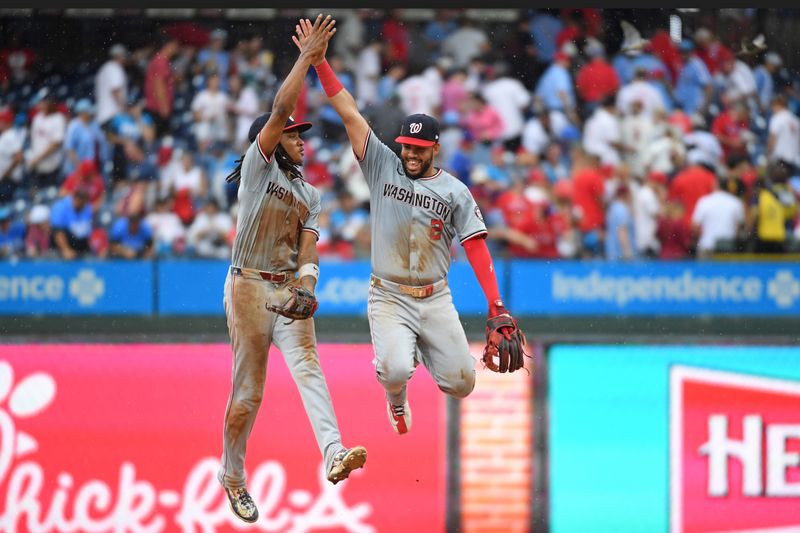 Aug 18, 2024; Philadelphia, Pennsylvania, USA; Washington Nationals shortstop CJ Abrams (5) and second base Luis García Jr. (2) celebrate win against the Philadelphia Phillies at Citizens Bank Park. Mandatory Credit: Eric Hartline-USA TODAY Sports