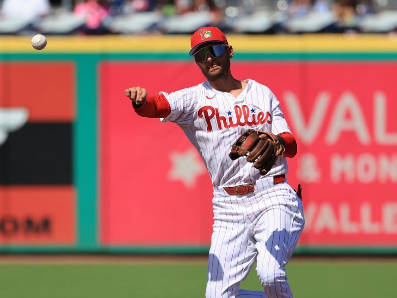 Mar 7, 2026; Clearwater, Florida, USA;  Philadelphia Phillies shortstop Trea Turner (7) throws the ball to first base for an out during the third inning against the Toronto Blue Jays at BayCare Ballpark. Mandatory Credit: Kim Klement Neitzel-Imagn Images